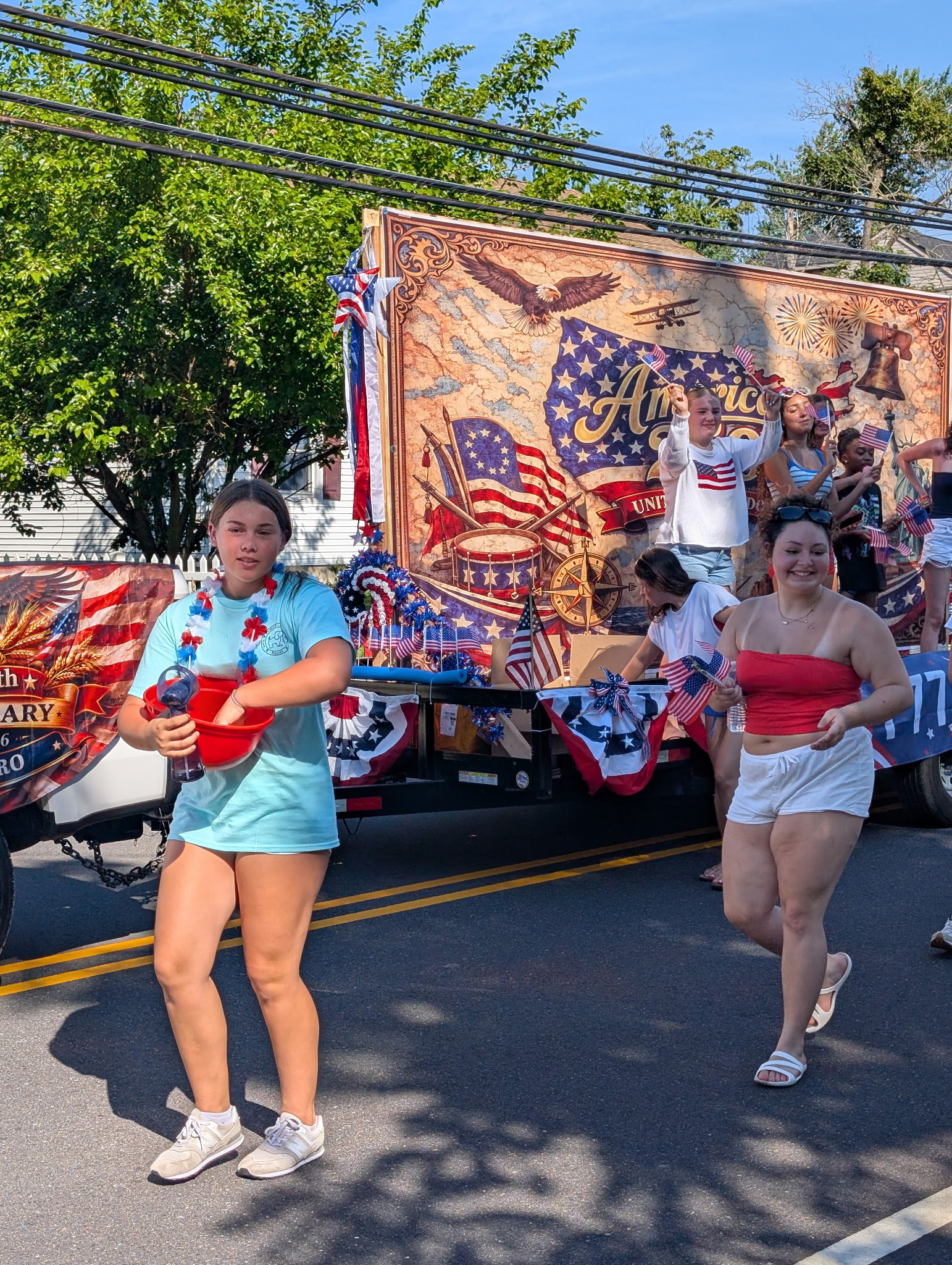 Participants walk alongside the America 250 float on the White Horse Pike — Berlin NJ July 4th 2026 parade