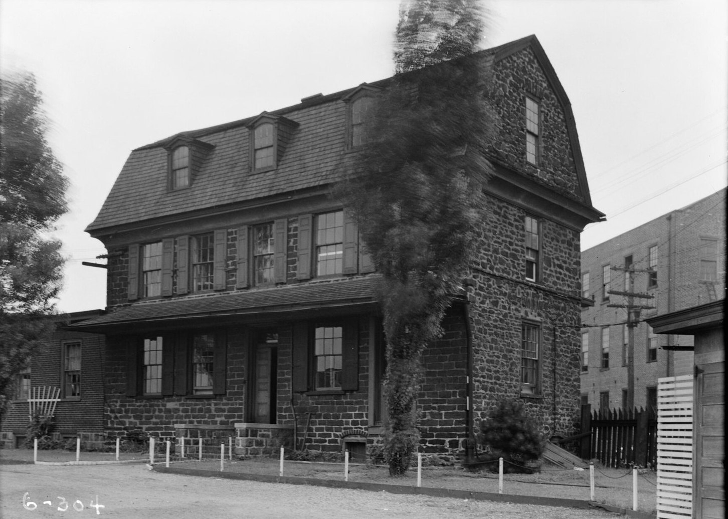 Black-and-white 1936 photograph of the Benjamin Cooper House in Camden, a stone building with a gambrel roof and three dormer windows