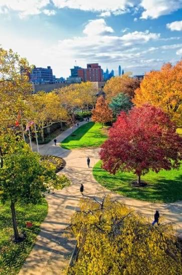 A multiuse greenway path with the Philadelphia skyline beyond &mdash; the vision behind the 34-mile Camden County LINK Trail