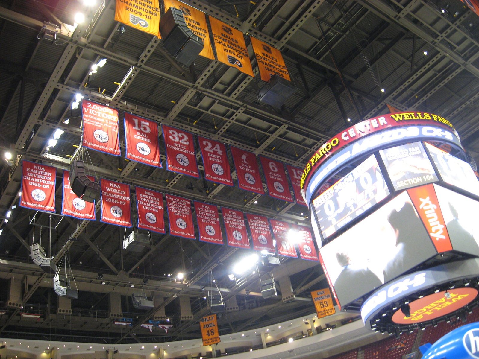 Flyers conference championship banners and 76ers banners hanging from the arena rafters
