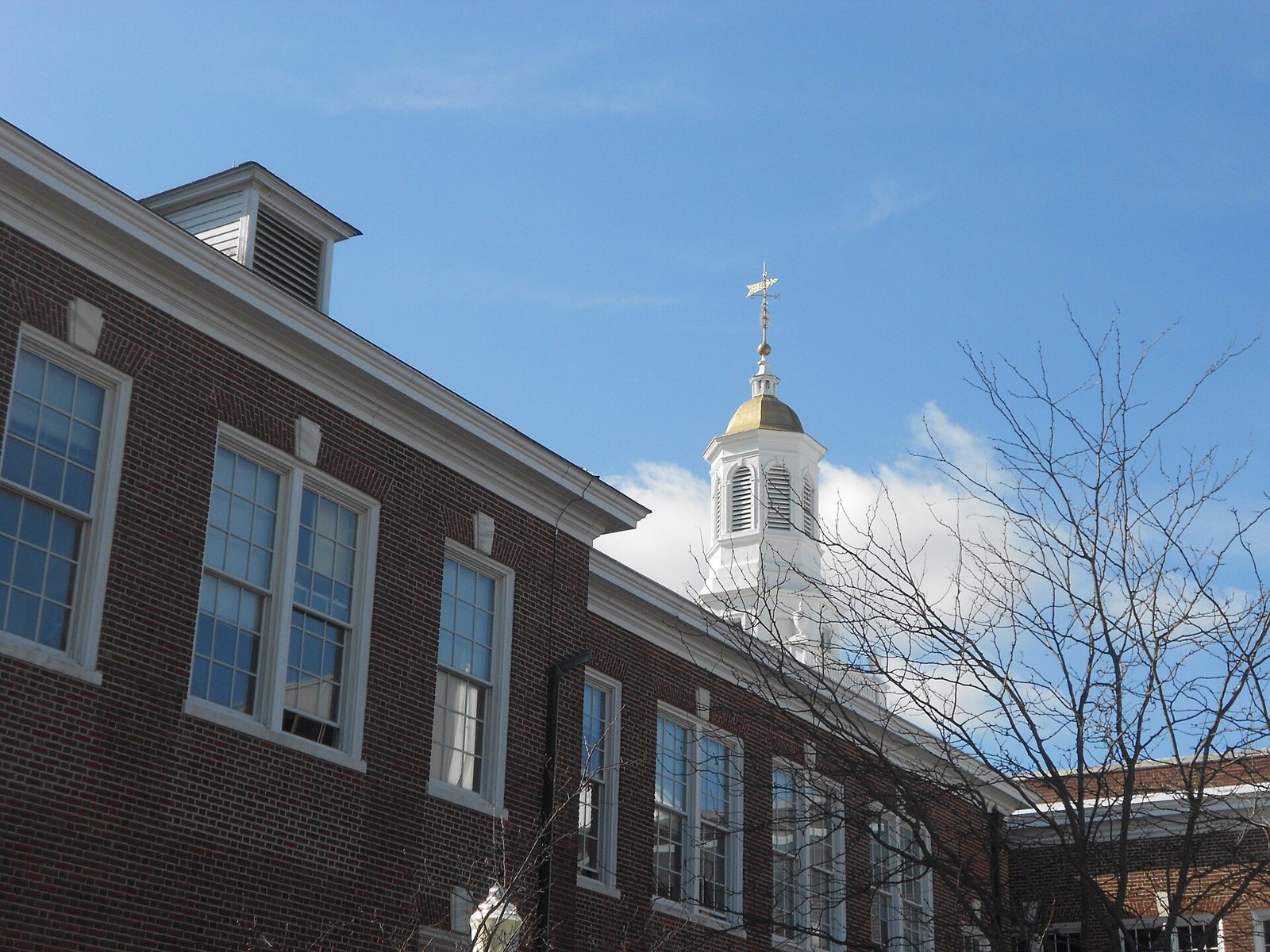 Brick facade and white cupola of Bunce Hall at Rowan University in Glassboro