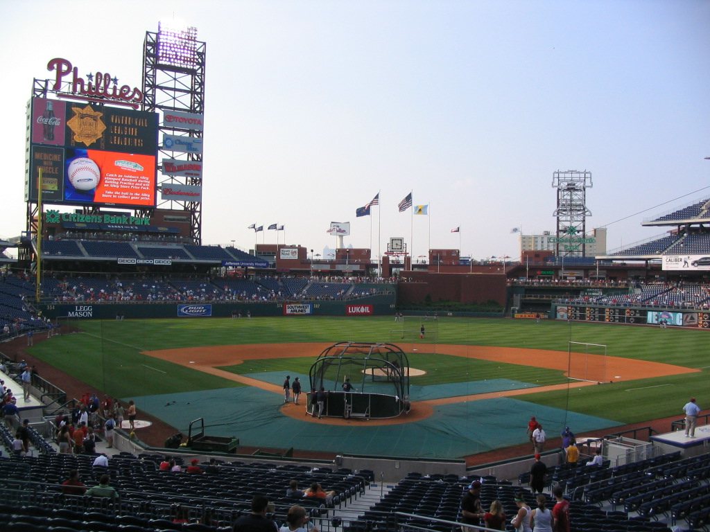 Citizens Bank Park seen from the stands during batting practice, with the Phillies sign over the scoreboard