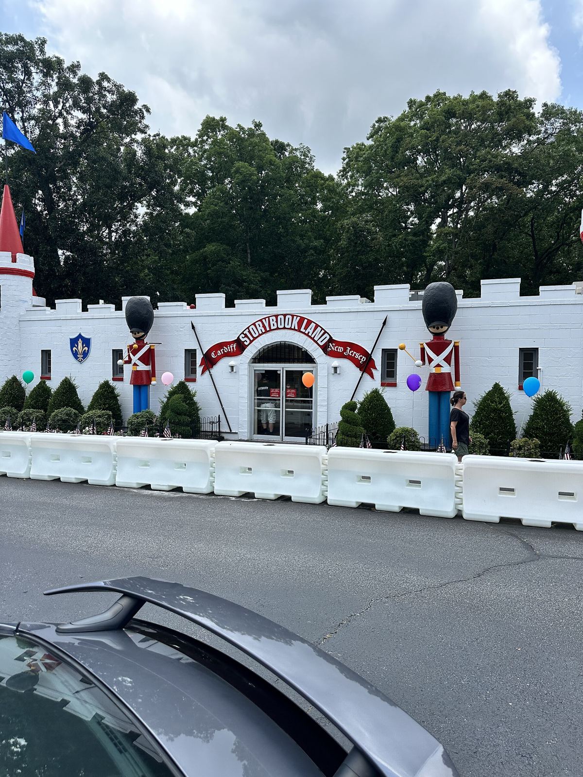 The castle-style entrance building of Storybook Land with toy-soldier statues