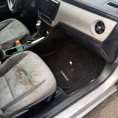 Dirty car interior — stained seat and floor mat — before TCB Auto Detailing South Jersey